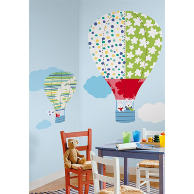 RoomMates wall decal Hot Air Balloons, colourful patterned hot air balloons with clouds on a light blue children's room wall above a table
