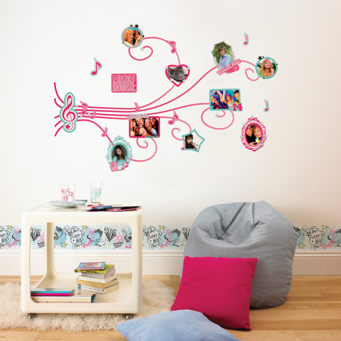 decofun border High School Musical on a pale blue children's room wall, with a musical-note vine and photo frame motif above