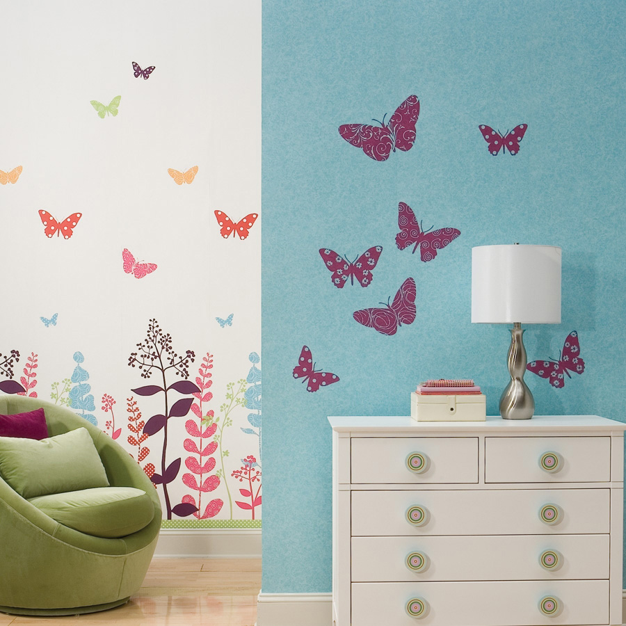 RoomMates wall decal Flocked Butterfly, colourful butterfly motifs on a two-tone wall with a floral pattern along the lower section