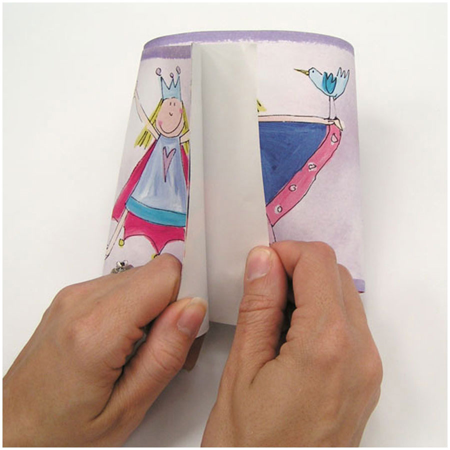 RoomMates border Fairy Princess, hands folding the border strip with a fairy and bird motif, usage example
