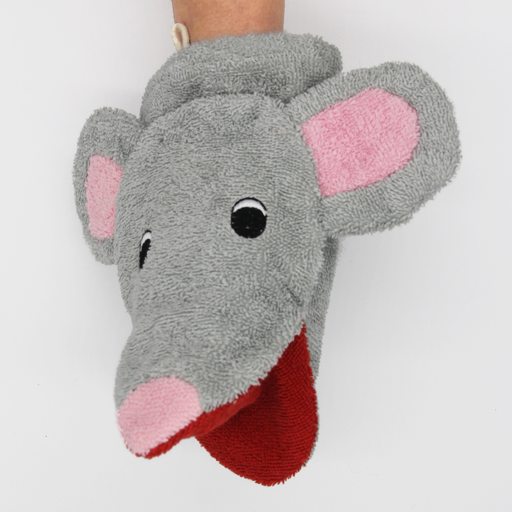 Fürnis organic washcloth mouse Mona worn as mitt on arm, pink nose tip and long red tongue visible