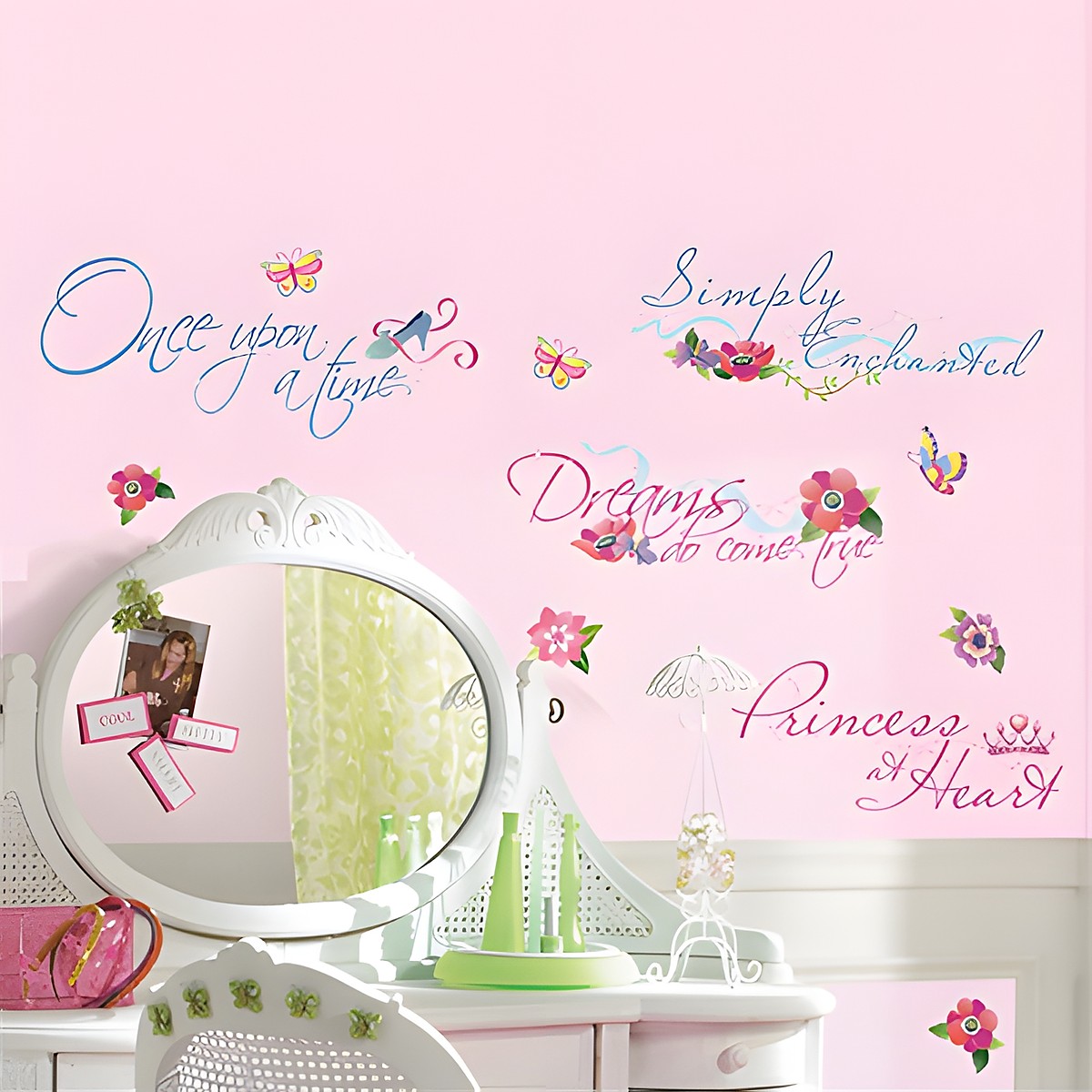 RoomMates quote wall decal Disney Princess, flowing lettering such as "Once upon a time" and "Dreams do come true" with floral motifs on a pink children's room wall