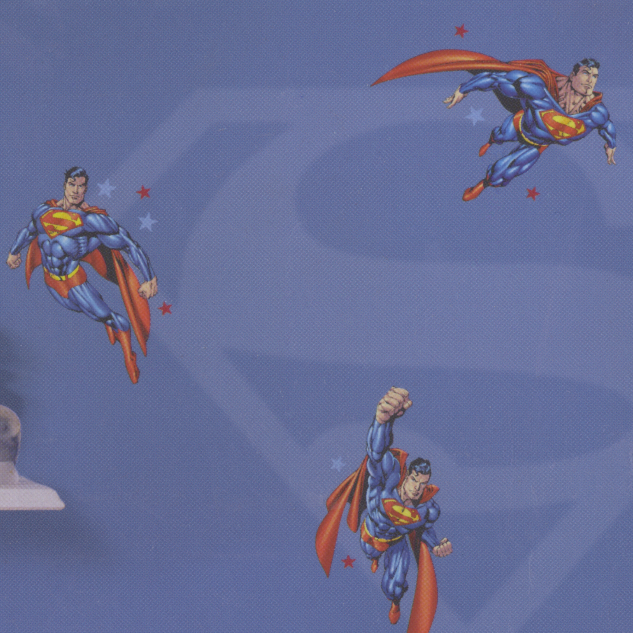 decofun wall decal Superman on a blue children's room wall with a large S-shield motif and several flying Superman figures
