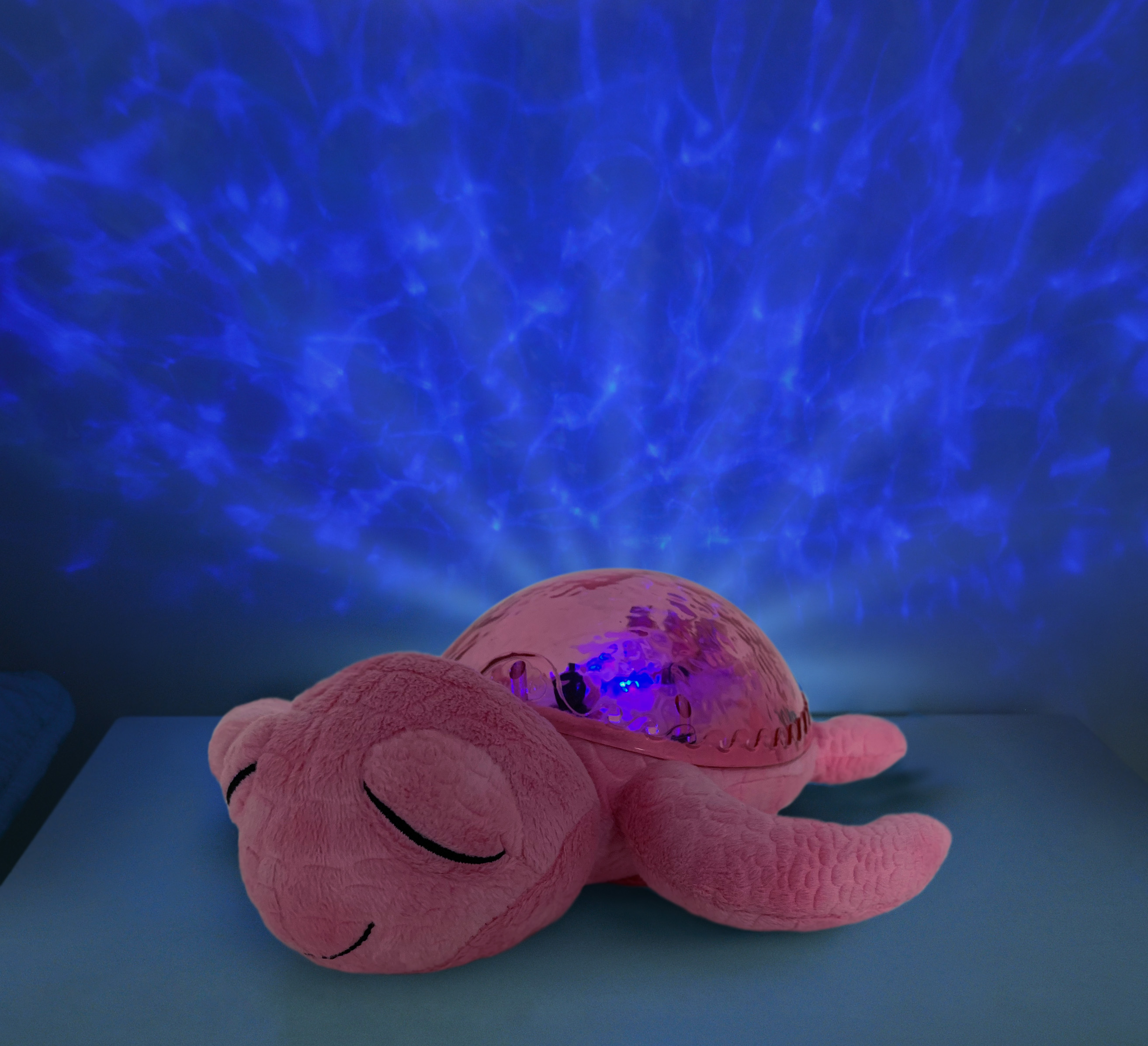 Cloud b sleep aid Tranquil Turtle Pink, plush toy glowing with blue star projection in the dark