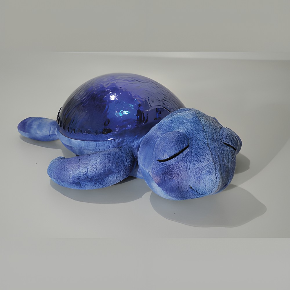 Cloud b sleep aid Tranquil Turtle Ocean, close-up of the shimmering projector shell, side view